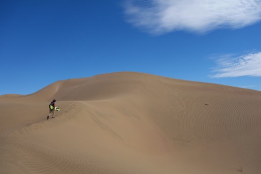 Climbing up the sand dunes on Cerro Blanco